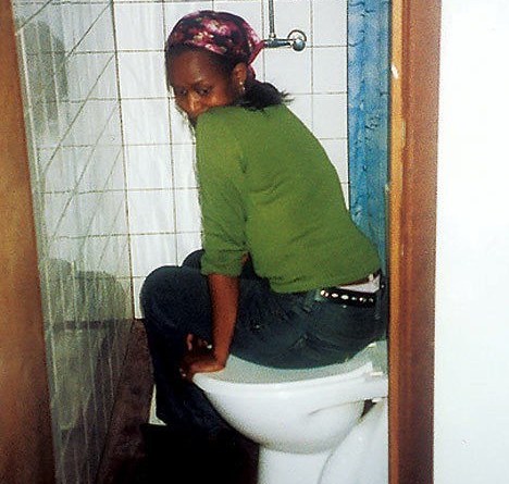 immaculee in toilet where she lived for 90 days with 7 other women